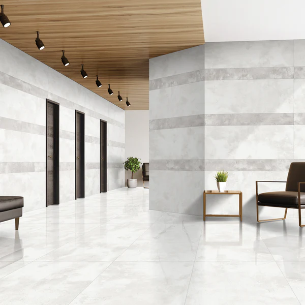 Luxor porcelain tile on walls and floors in a modern hallway, featuring glossy white tiles with light grey bands.
