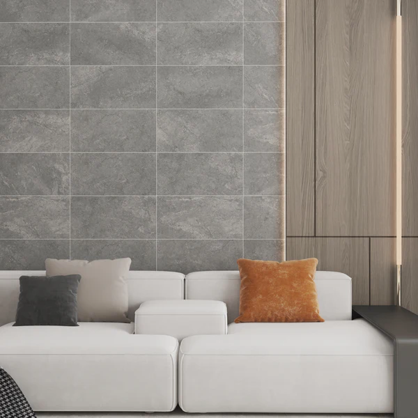 Grey Texas Wall & Floor Tile with a subtle concrete-look finish, used as an interior living room feature wall, paired with modern furniture.