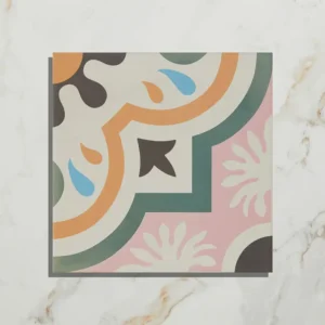 Cabana Porcelain New Orleans 20x20cm tile with a colorful pink, orange, green, and blue floral quarter-pattern on a light marble background.