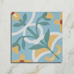 Cabana Porcelain Sicily 20x20cm tile with a colorful blue, yellow, and green floral pattern on a light marble background, shown close-up.