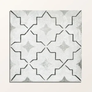 Cuba Porcelain Como 20x20cm tile close-up with a grey and black quatrefoil geometric pattern on a distressed, light grey background.