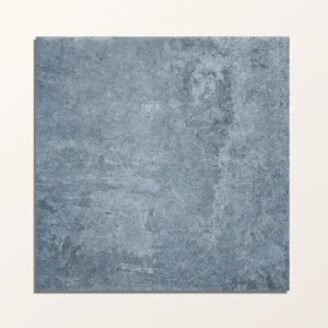 Cuba Porcelain Indigo Field 20x20cm tile with a distressed matte gray/blue finish and subtle natural variation.