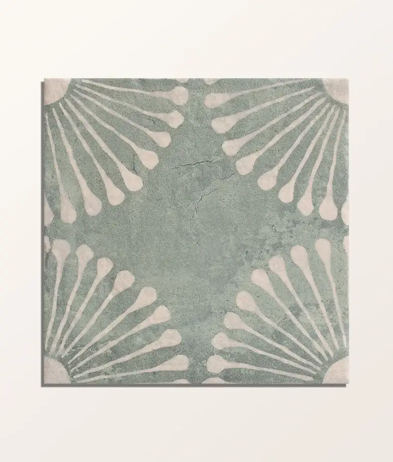 Vedado Mint Green 20x20cm porcelain tile with a distressed blue/green finish and a white shell/fan pattern in each corner.