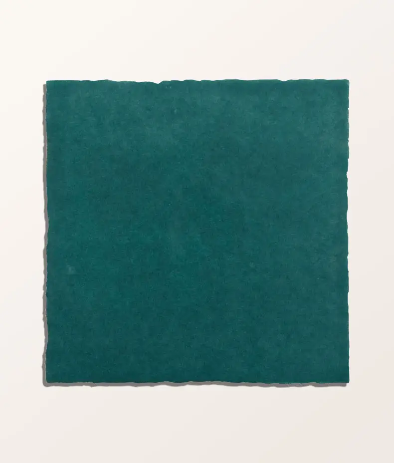 Maroc Porcelain Aquamarine 9.9x9.9cm tiles covering a kitchen backsplash, showcasing the rustic, faded blue/green finish.