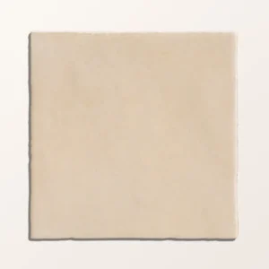 Maroc Porcelain Beige 9.9x9.9cm tiles covering a kitchen backsplash with white cabinets, showing the rustic, faded beige finish.