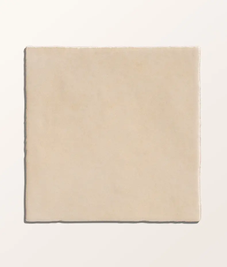 Maroc Porcelain Beige 9.9x9.9cm tiles covering a kitchen backsplash with white cabinets, showing the rustic, faded beige finish.