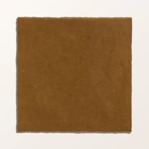 Maroc Porcelain Khaki 9.9x9.9cm tiles covering a kitchen backsplash, showcasing the rustic, faded khaki/brown finish and subtle surface variation.