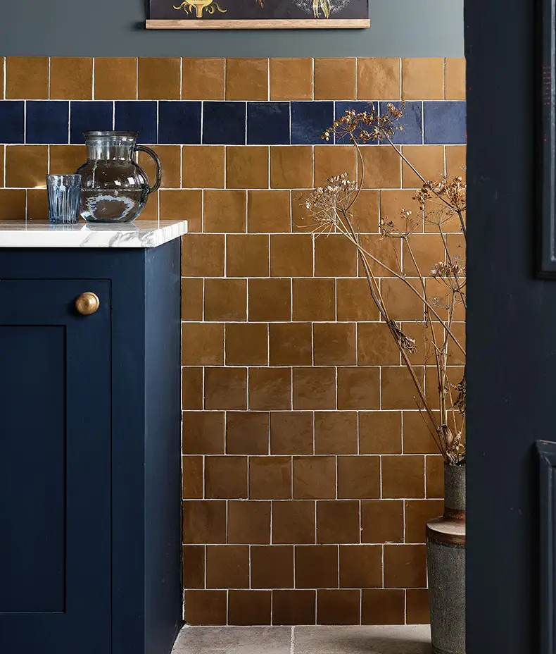 Maroc Porcelain Khaki 9.9x9.9cm tile with a distressed, faded khaki/brown surface and subtle edge variation for a rustic, handmade look.