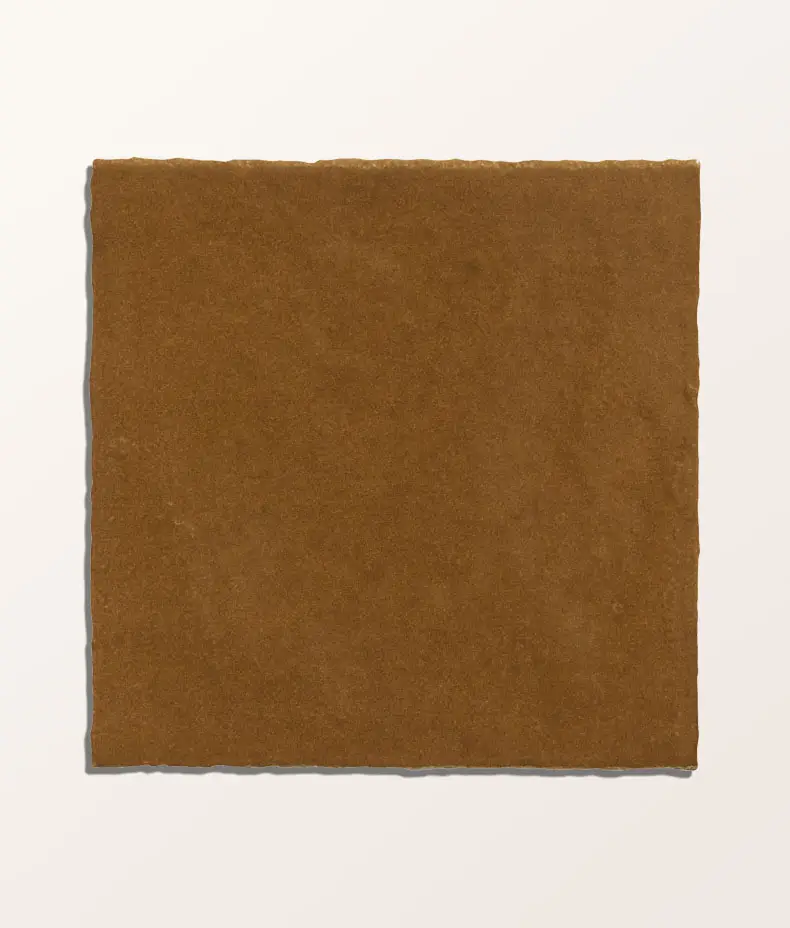 Maroc Porcelain Khaki 9.9x9.9cm tiles covering a kitchen backsplash, showcasing the rustic, faded khaki/brown finish and subtle surface variation.