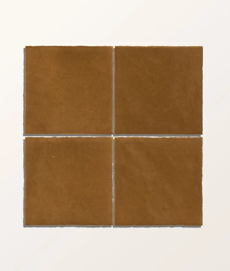 Maroc Porcelain Khaki 9.9x9.9cm tile with a distressed, faded khaki/brown surface and subtle edge variation for a rustic, handmade look.