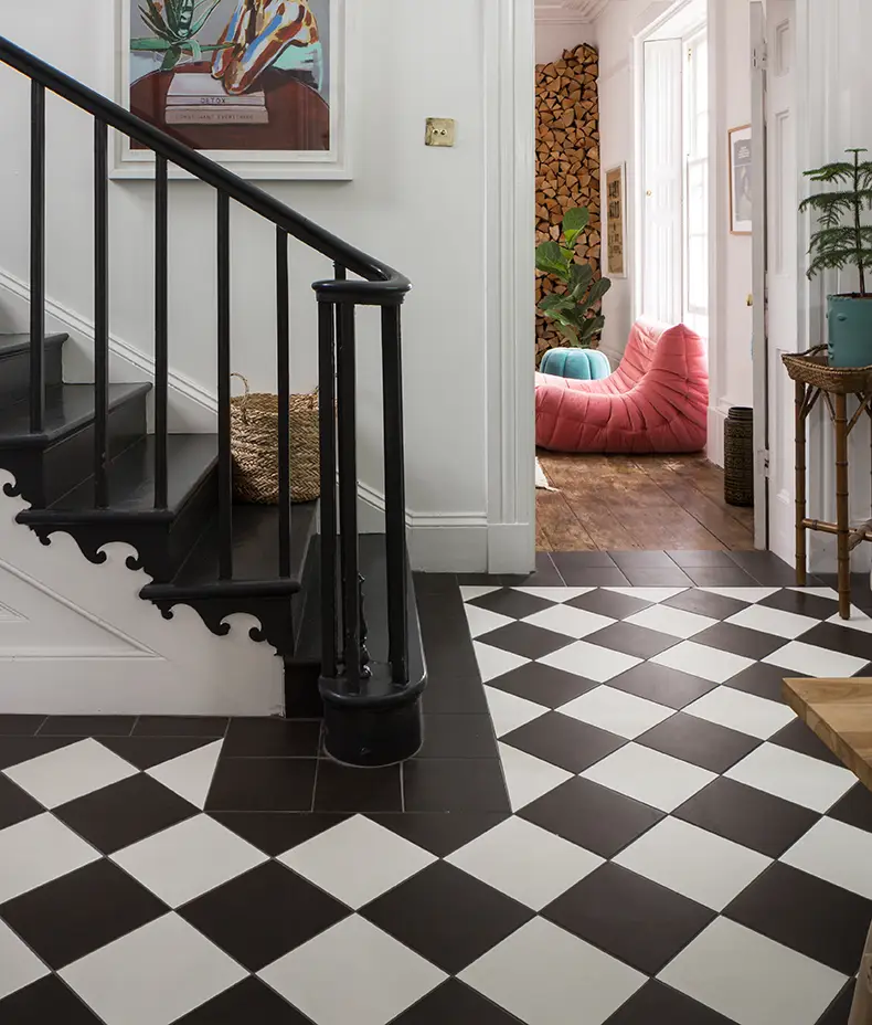 PORTARE Brompton Field Liquorice 20x20cm tiles used with white tiles to create a large black and white diagonal checkerboard floor in a hallway.