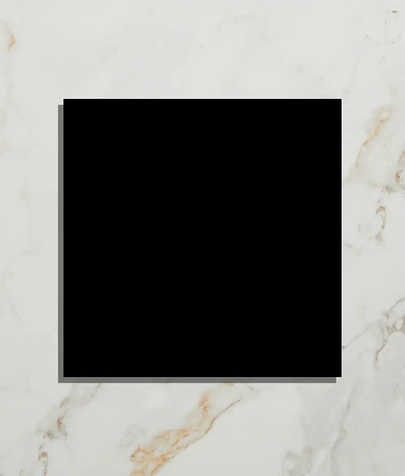 Black square tile on white marble background.