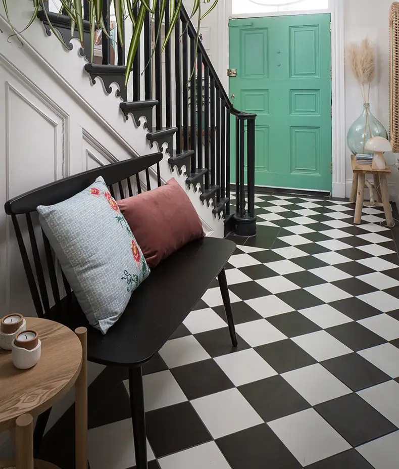 PORTARE Brompton Field Milk 20x20cm tiles used with black tiles to create a large black and white diagonal checkerboard floor in a stylish hallway.