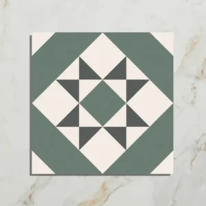 PORTARE Brompton Greenwich 20x20cm tile with a sage green, off-white, and charcoal geometric star pattern on a white marble background.