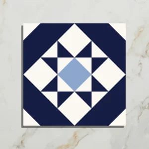 PORTARE Brompton Kew 20x20cm tile with a navy blue, light blue, and white star geometric pattern on a white marble background, shown close-up.